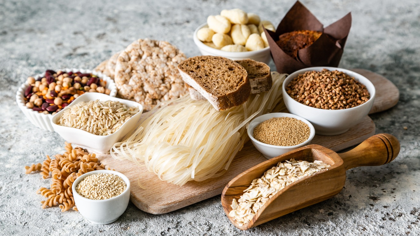 A well-organized gluten-free pantry with labeled jars of grains, gluten-free flours, nuts, and fresh produce, showcasing the essentials for a gluten-free lifestyle.