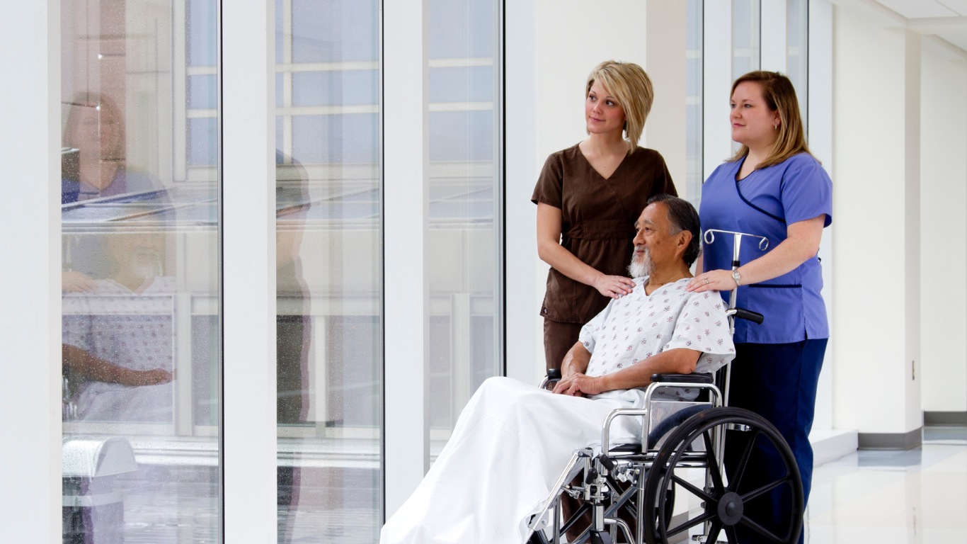 An image showing healthcare providers interacting with patients