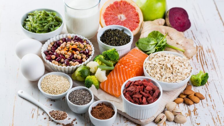 A colorful image of a balanced meal plate showcasing appropriate portions of proteins, carbohydrates, vegetables, and healthy fats.