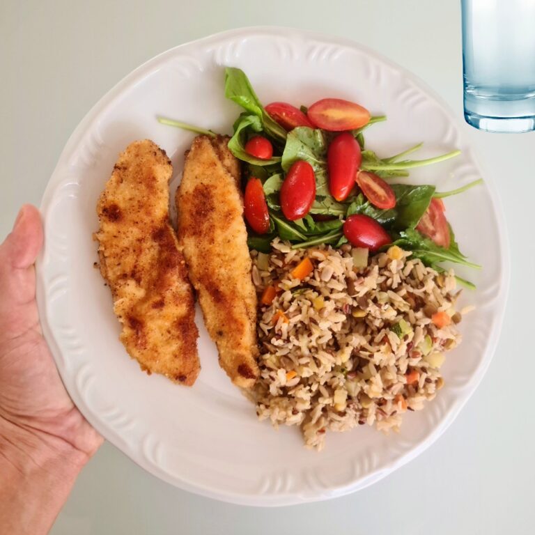 "Healthy balanced meal with vegetables, whole grains, and grilled chicken, accompanied by a water bottle and fitness gear symbolizing a 30-day weight loss plan."