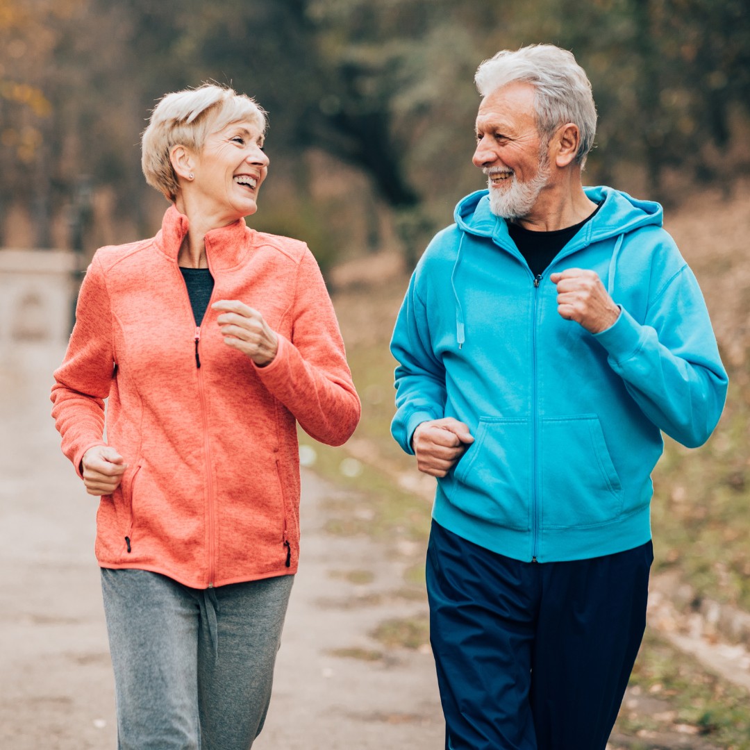 "Senior person walking outdoors in a park, staying active to promote healthy aging."