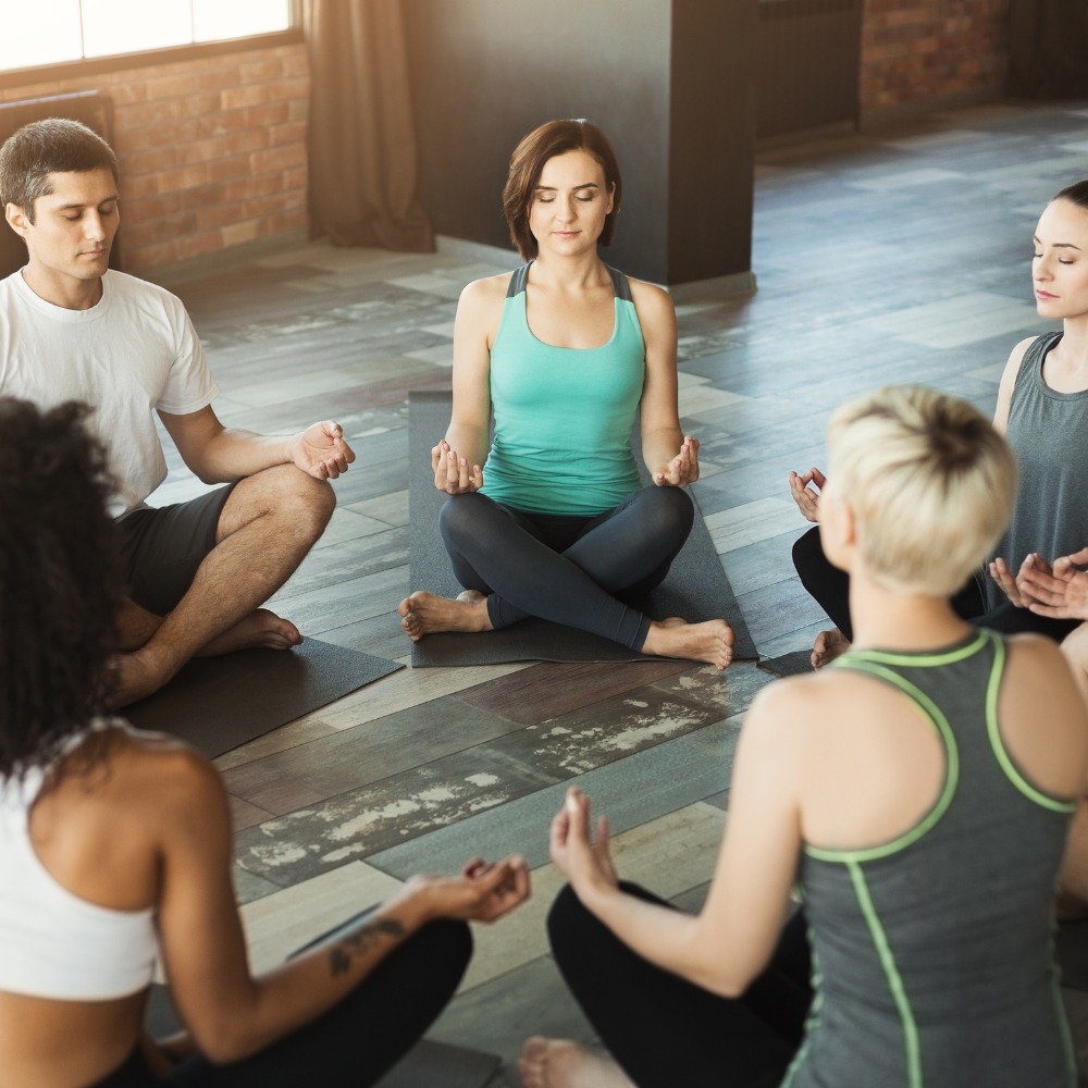 Diverse yoga practitioners with different body types, ages, and ethnicities practicing yoga in everyday settings, challenging the myth of the perfect yogi.