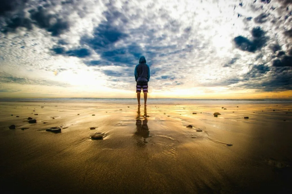 pexels-photo-301952-301952 Person Standing on Sand