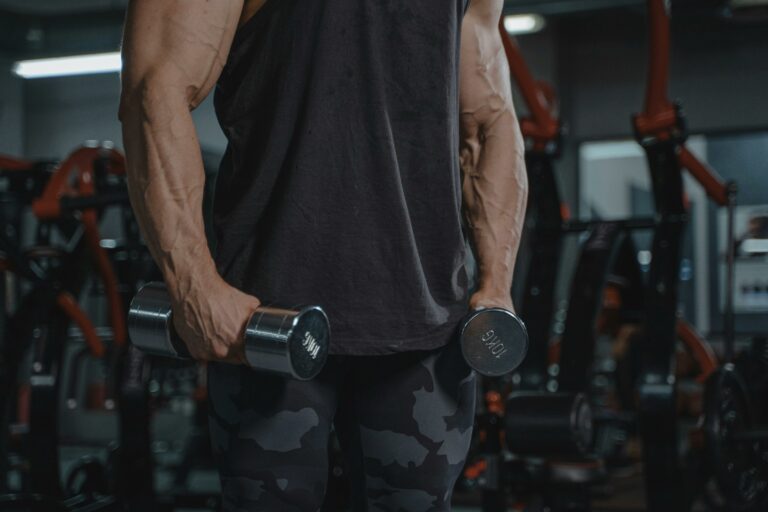 Man Holding Dumbbells