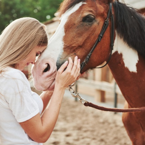 Woman meditating while horse riding in nature