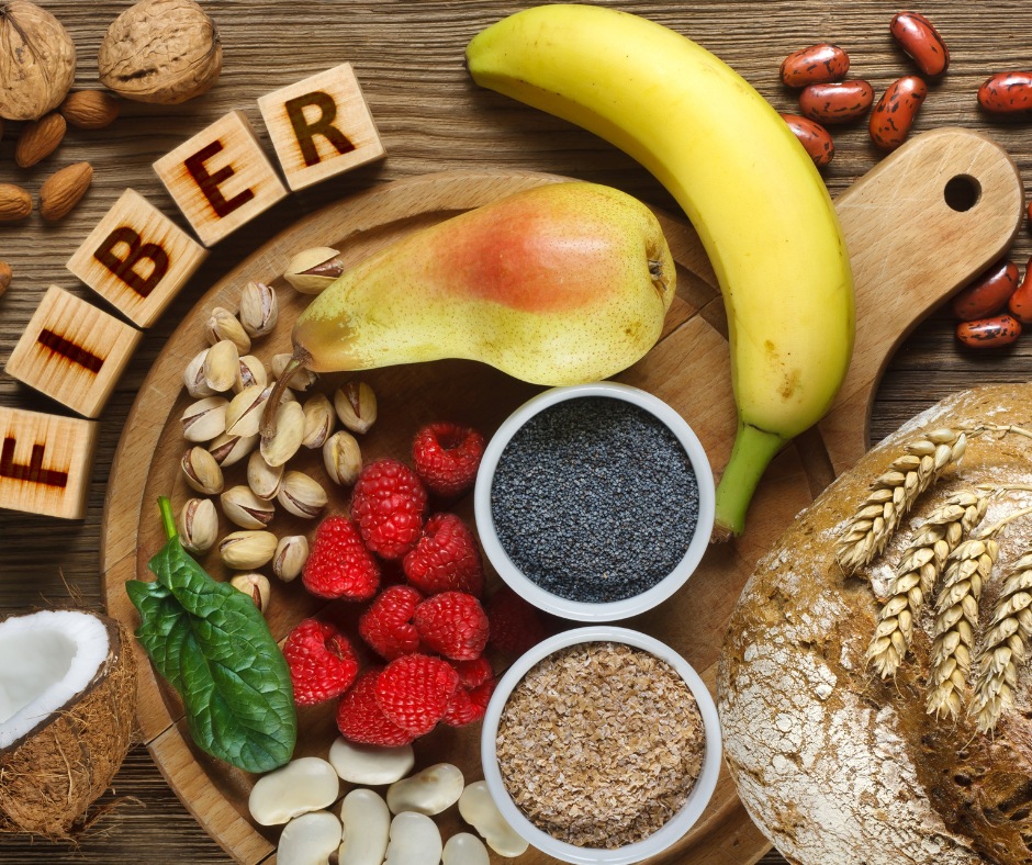 A colorful assortment of fiber-rich foods Fiber-rich foods like leafy greens, apples, carrots, and berries for a healthy gut.
