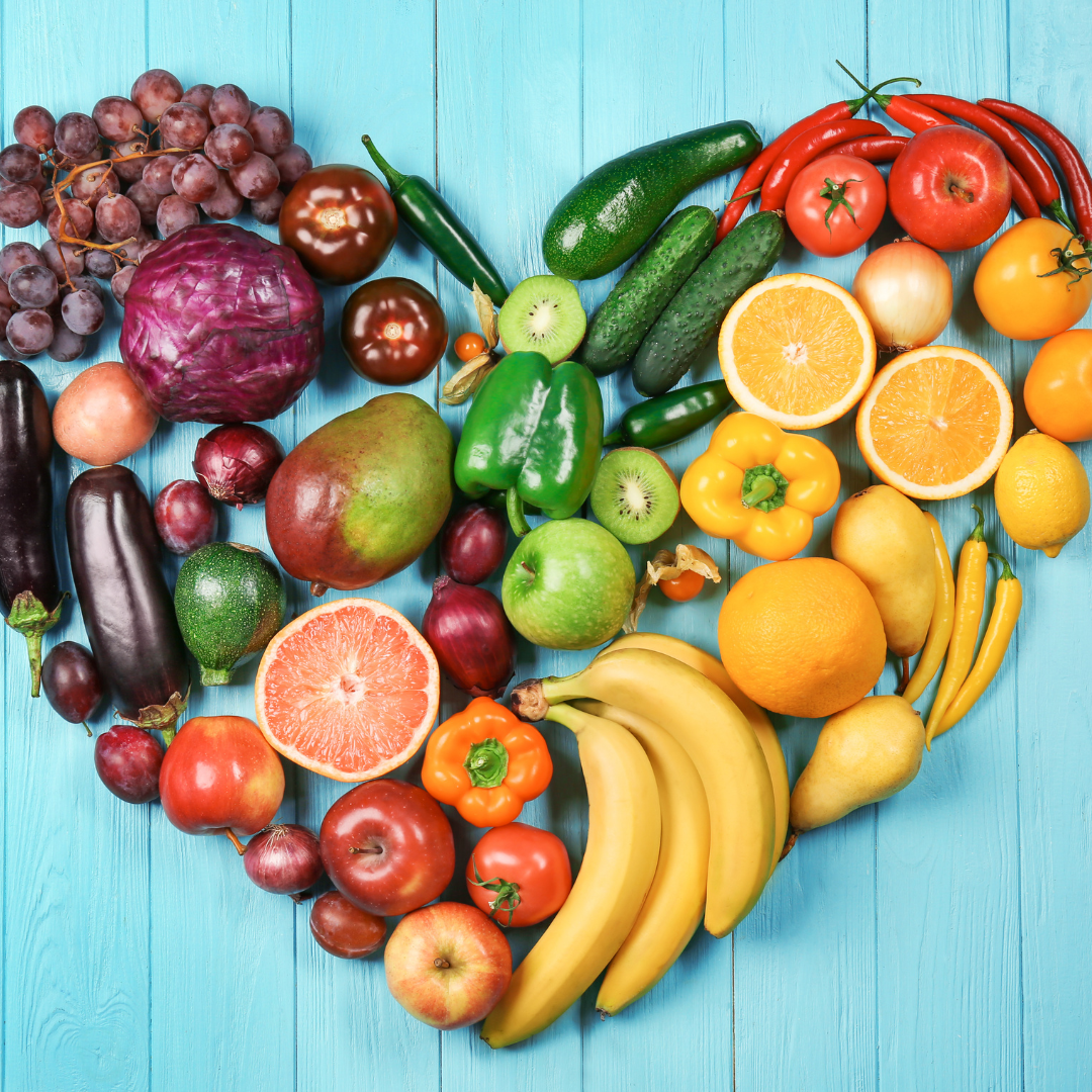 A colorful assortment of whole foods showcasing fruits, vegetables, grains, and nuts.