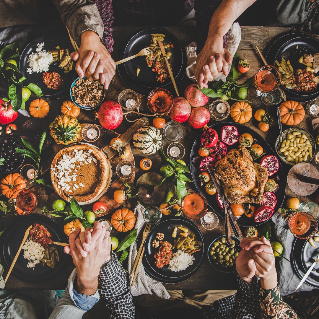 Healthy holiday table with colorful vegetables, lean proteins, and lighter desserts