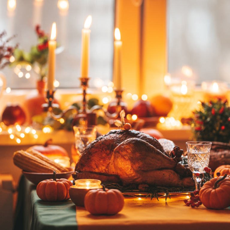 A holiday table set with candles and greenery, focusing on mindfulness over food.