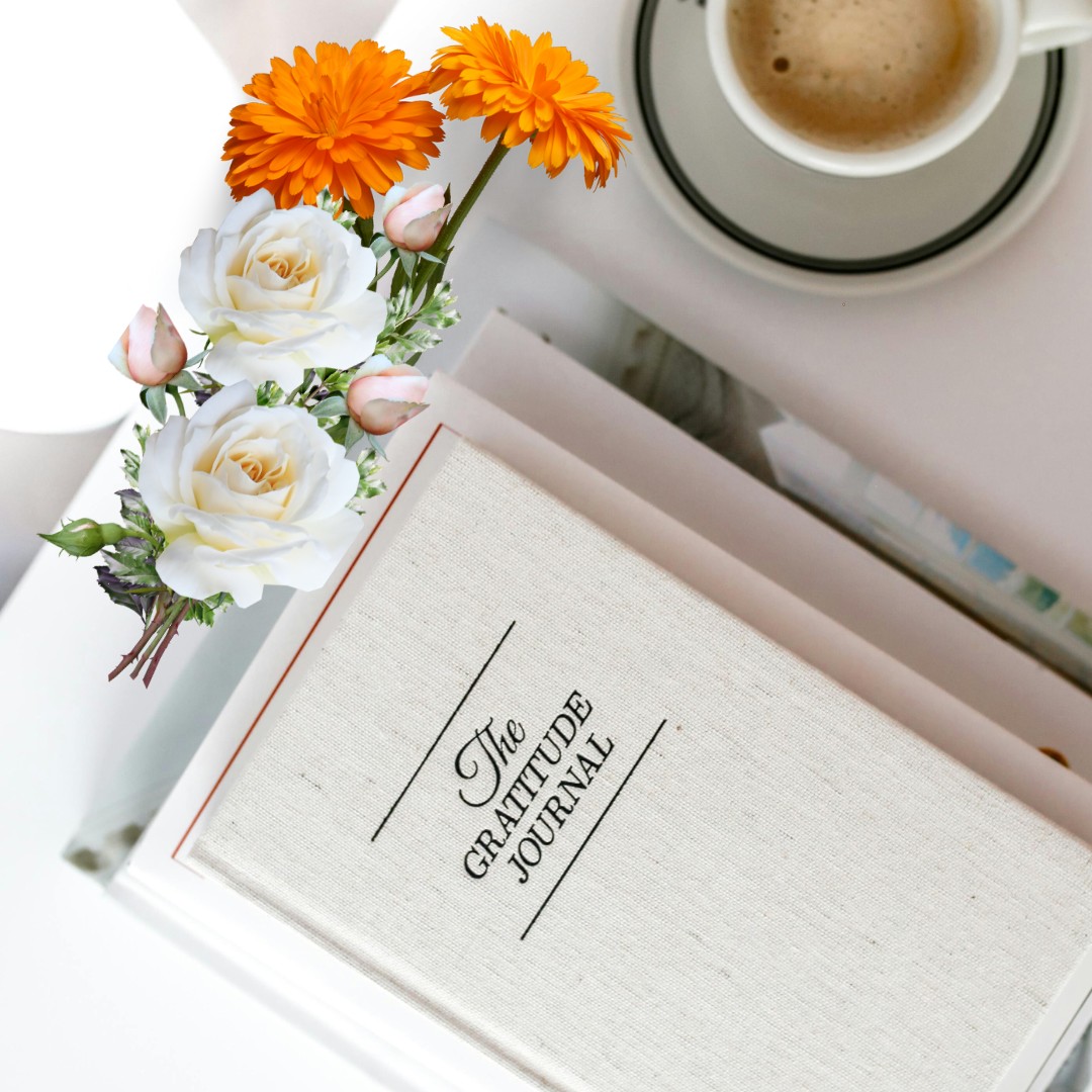 An open gratitude journal with a cup of herbal tea on the side, An open gratitude journal and herbal tea, representing evening positivity practices.