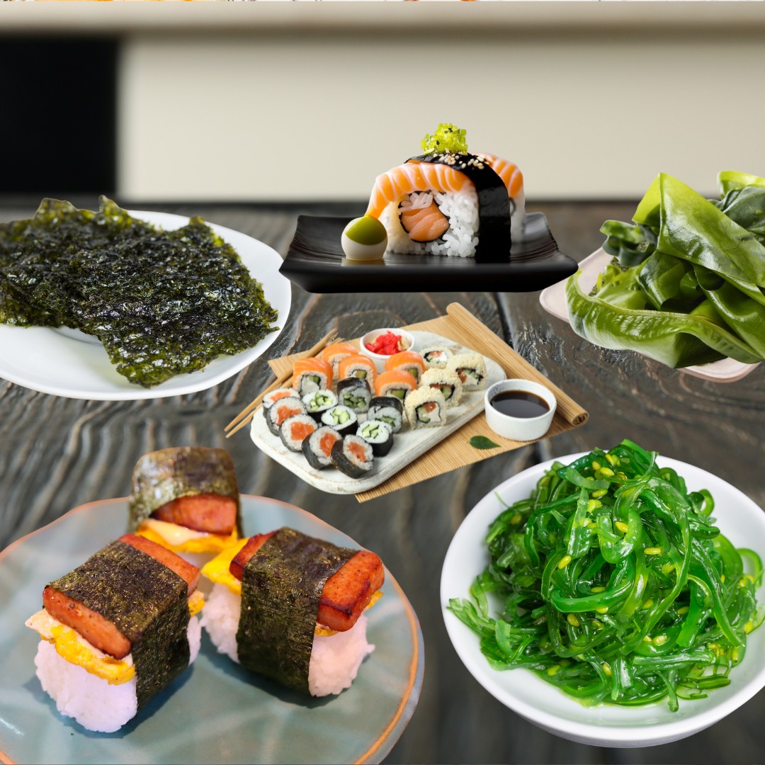 Assorted seaweed varieties, including nori sheets and wakame, laid out on a bamboo 