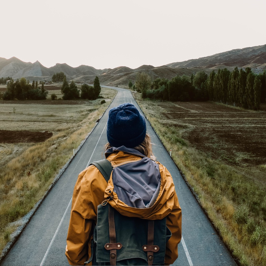 A person standing on a mountain at sunrise, representing transformation and new beginnings." A person standing on a mountain at sunrise, representing transformation and new beginnings."