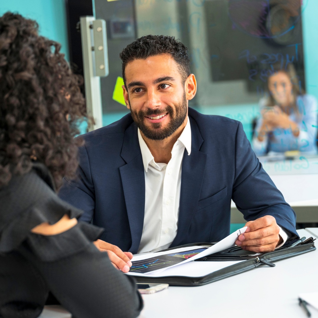 Manager conducting a one-on-one meeting to discuss employee well-being.