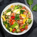 Healthy quinoa salad with fresh vegetables and herbs."