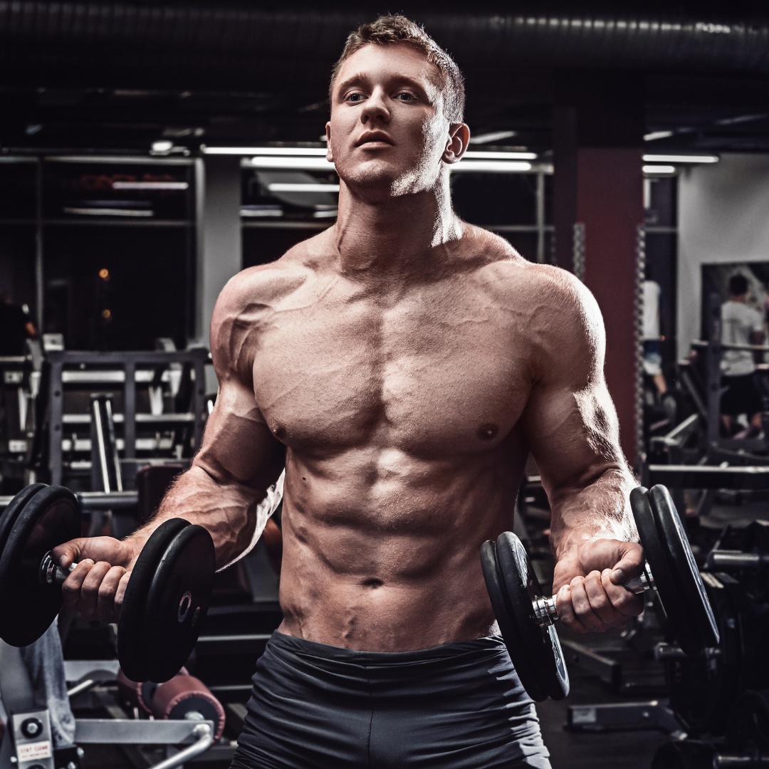 A strong individual lifting weights, representing an effective endomorph workout plan.