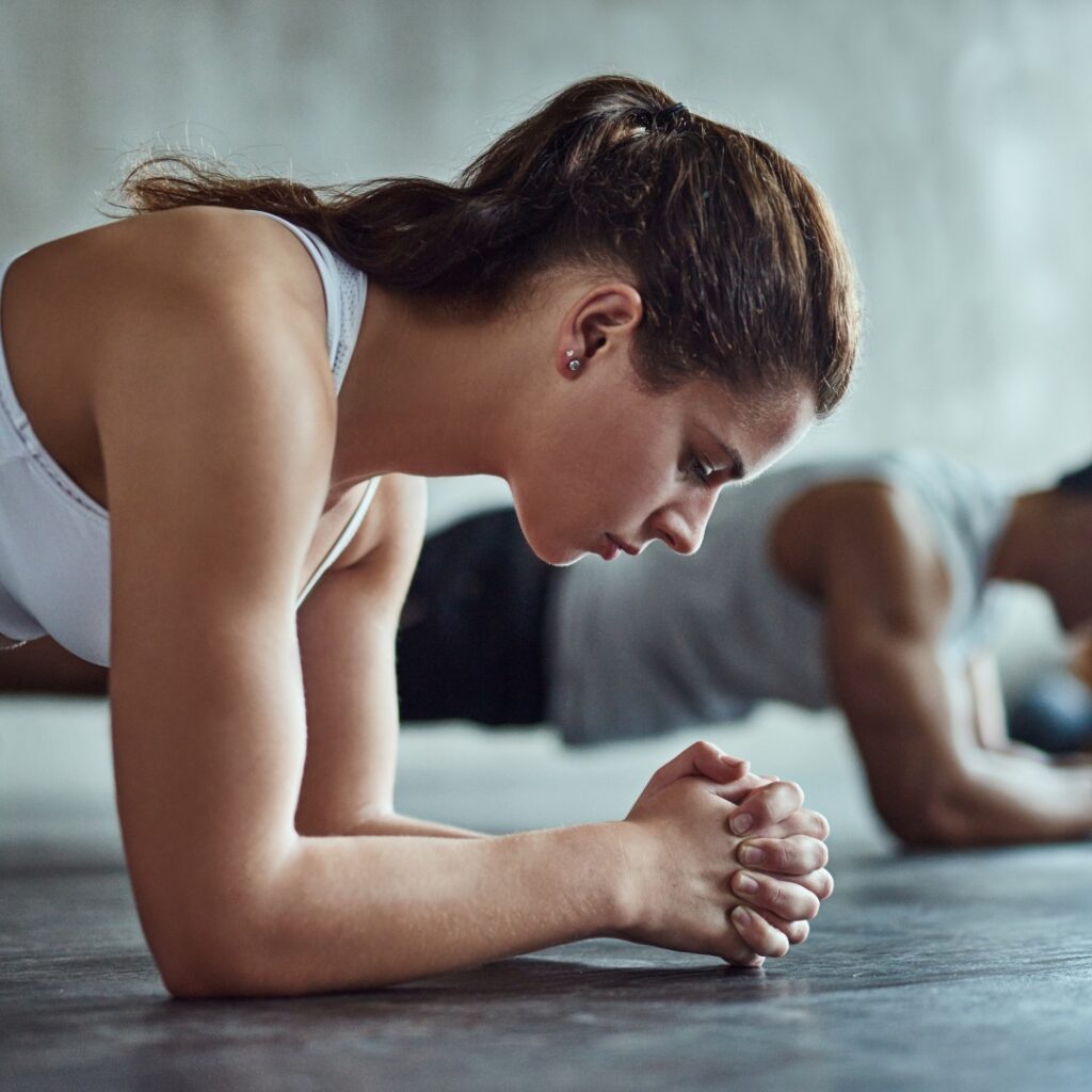 Person performing plank exercise for core strength