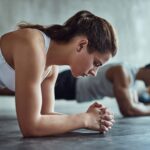 Person performing plank exercise for core strength